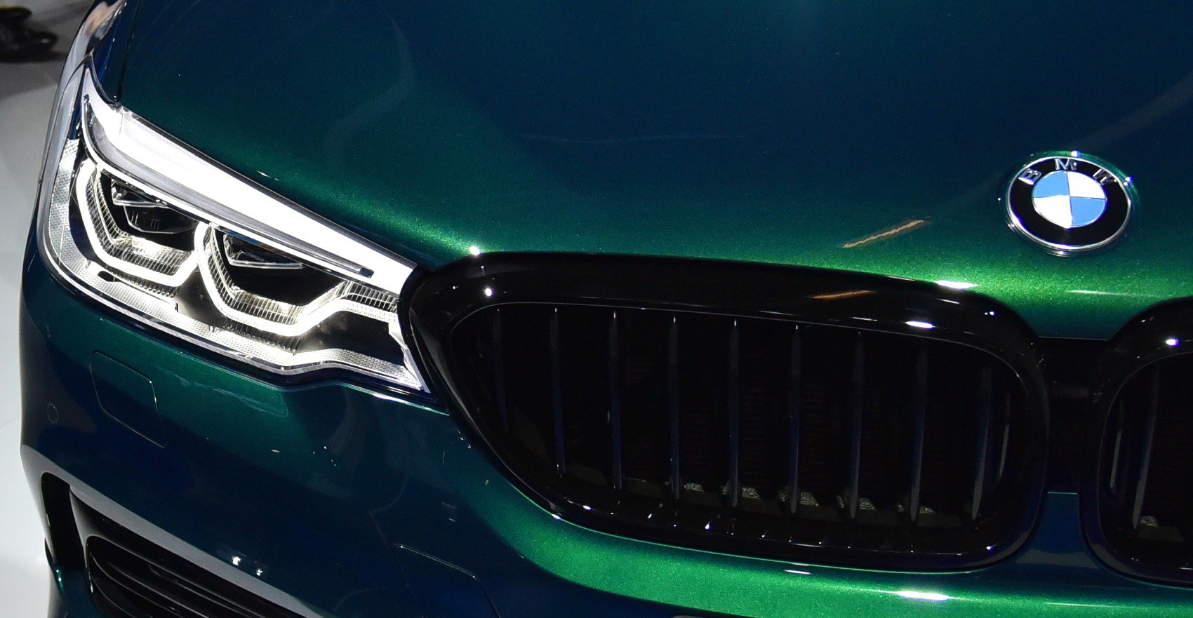 Close-up of front grille and dual LED headlights
