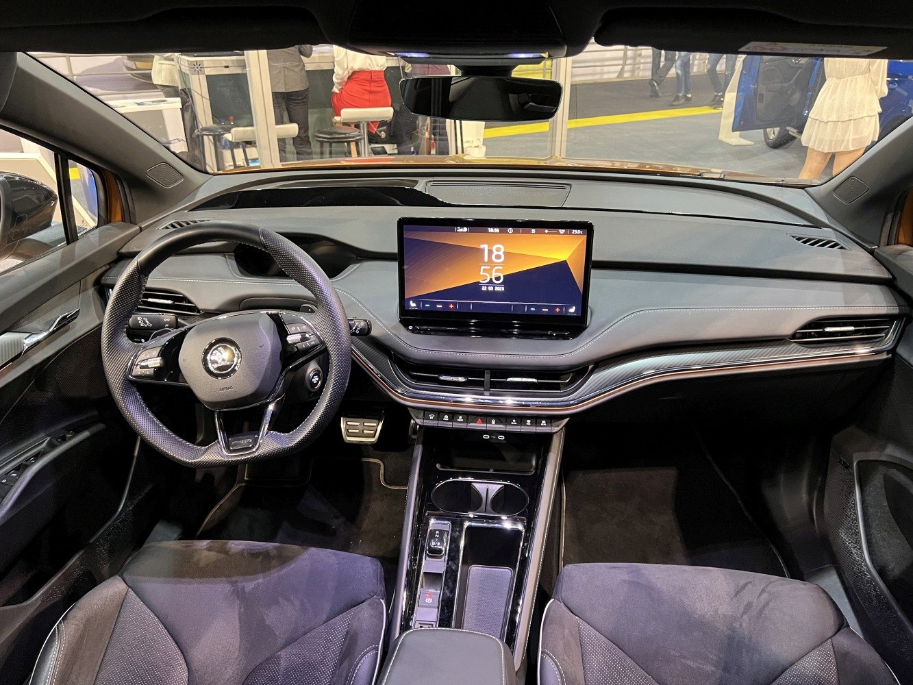 Modern car interior with digital display, sleek dashboard, and multifunction steering wheel