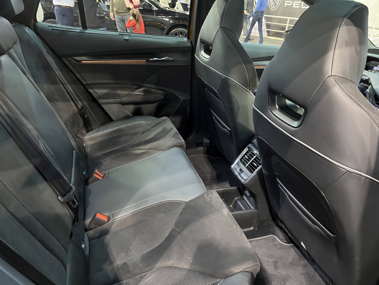 Rear passenger seats with premium upholstery and rear air vents