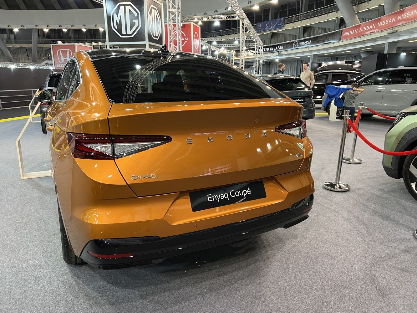 Rear view of a sleek electric SUV with distinct tail lights and angular design.
