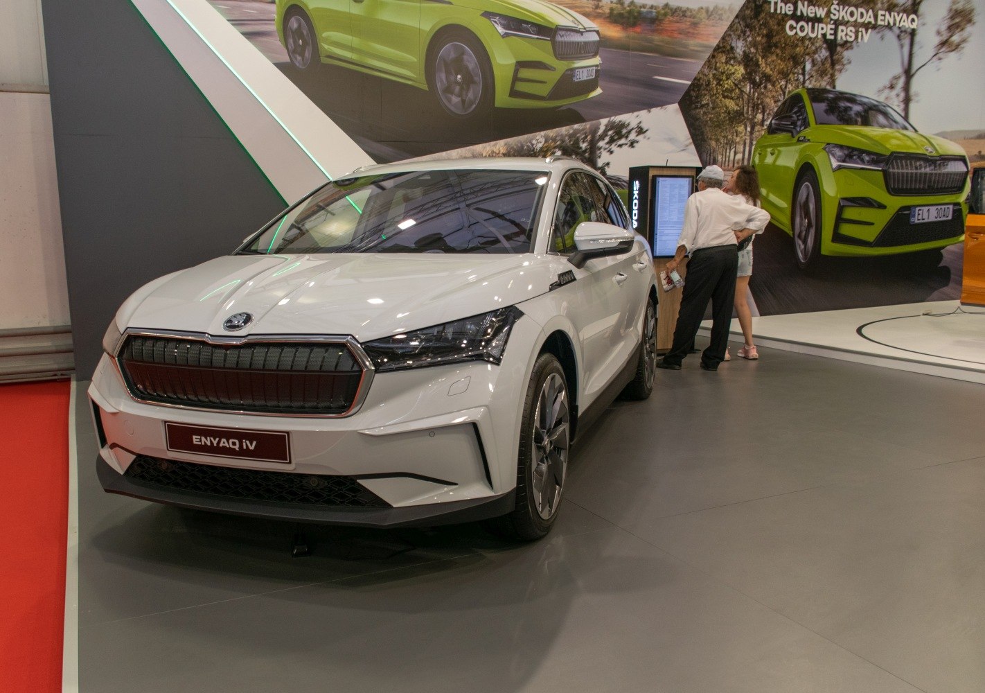 Front view of white electric SUV with distinctive grille and LED headlights