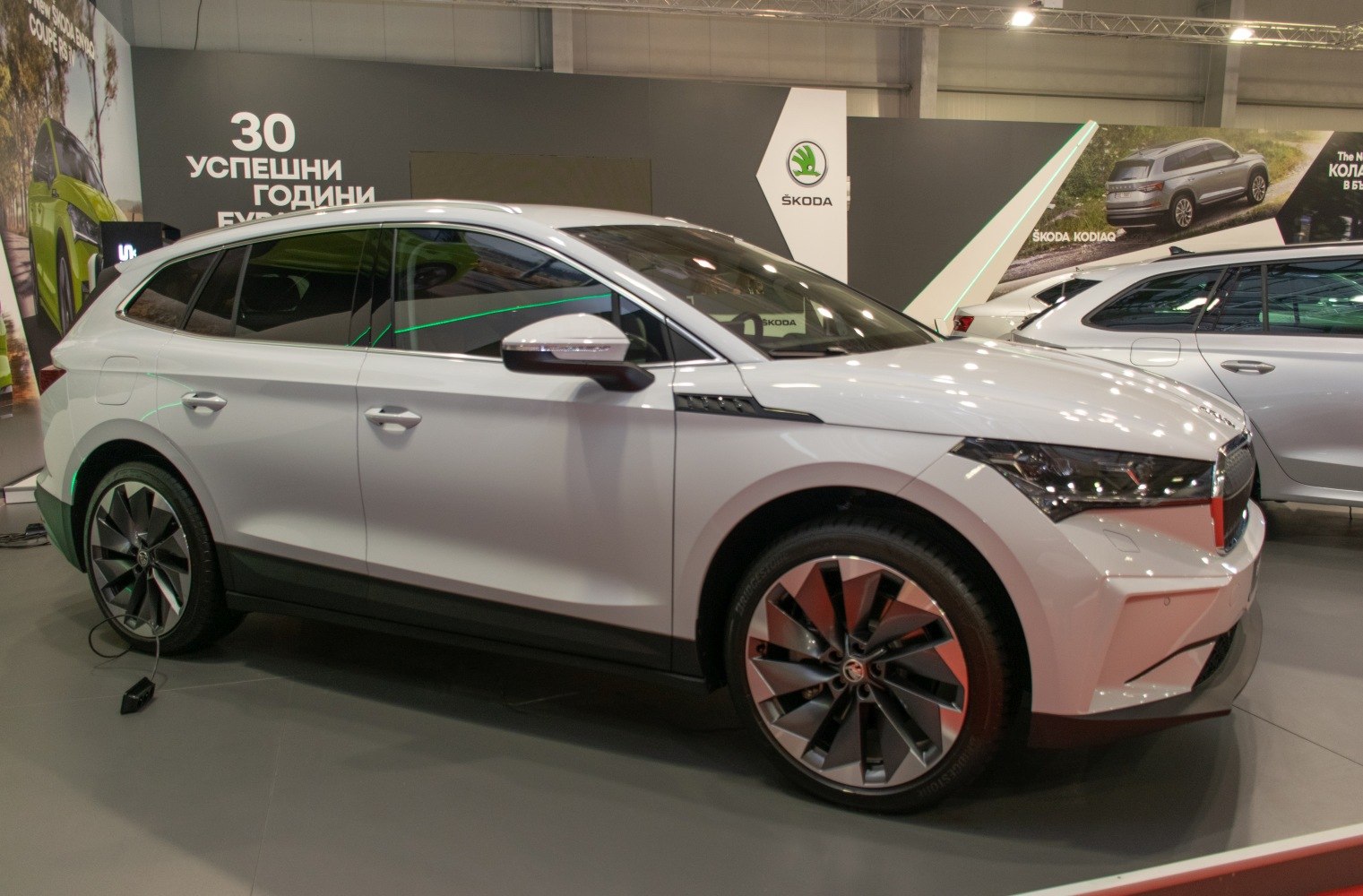 White modern SUV with aerodynamic design and distinctive wheels