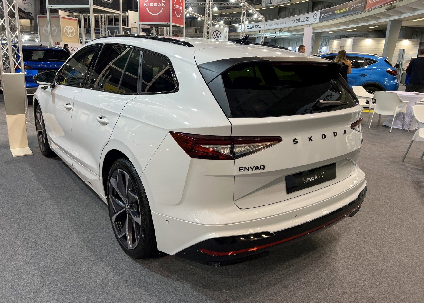 Rear view of white electric SUV with sleek taillights and sporty design