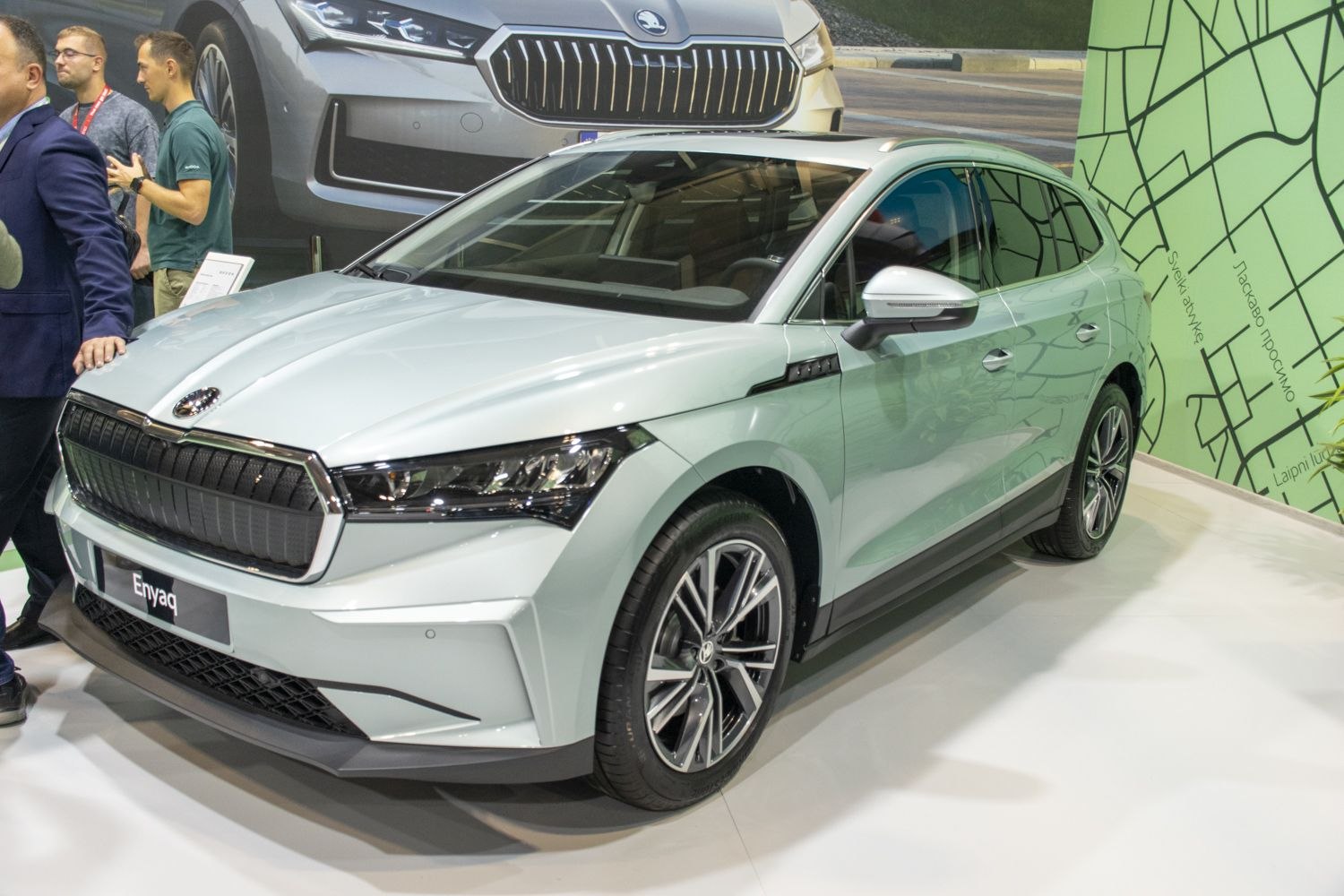 Front and side view of a sleek electric SUV with a modern grille and alloy wheels