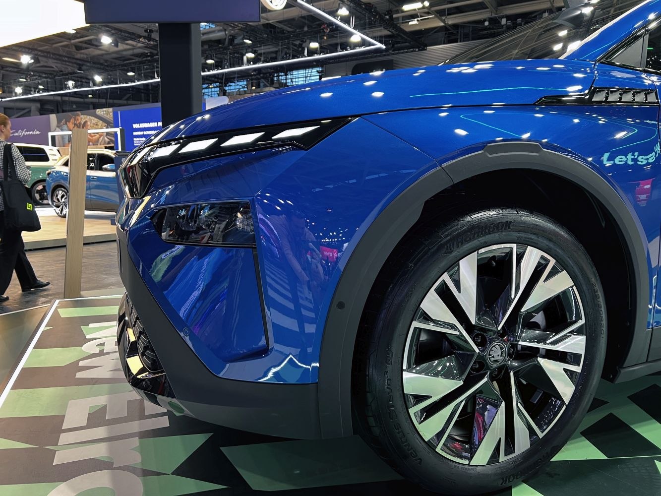 Close-up of modern SUV front headlight and alloy wheel design