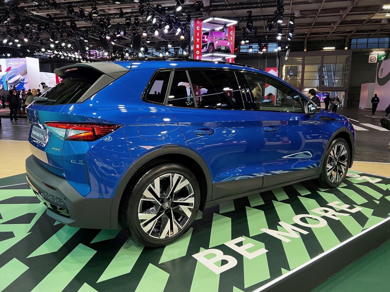 Side and rear view of blue modern SUV with alloy wheels