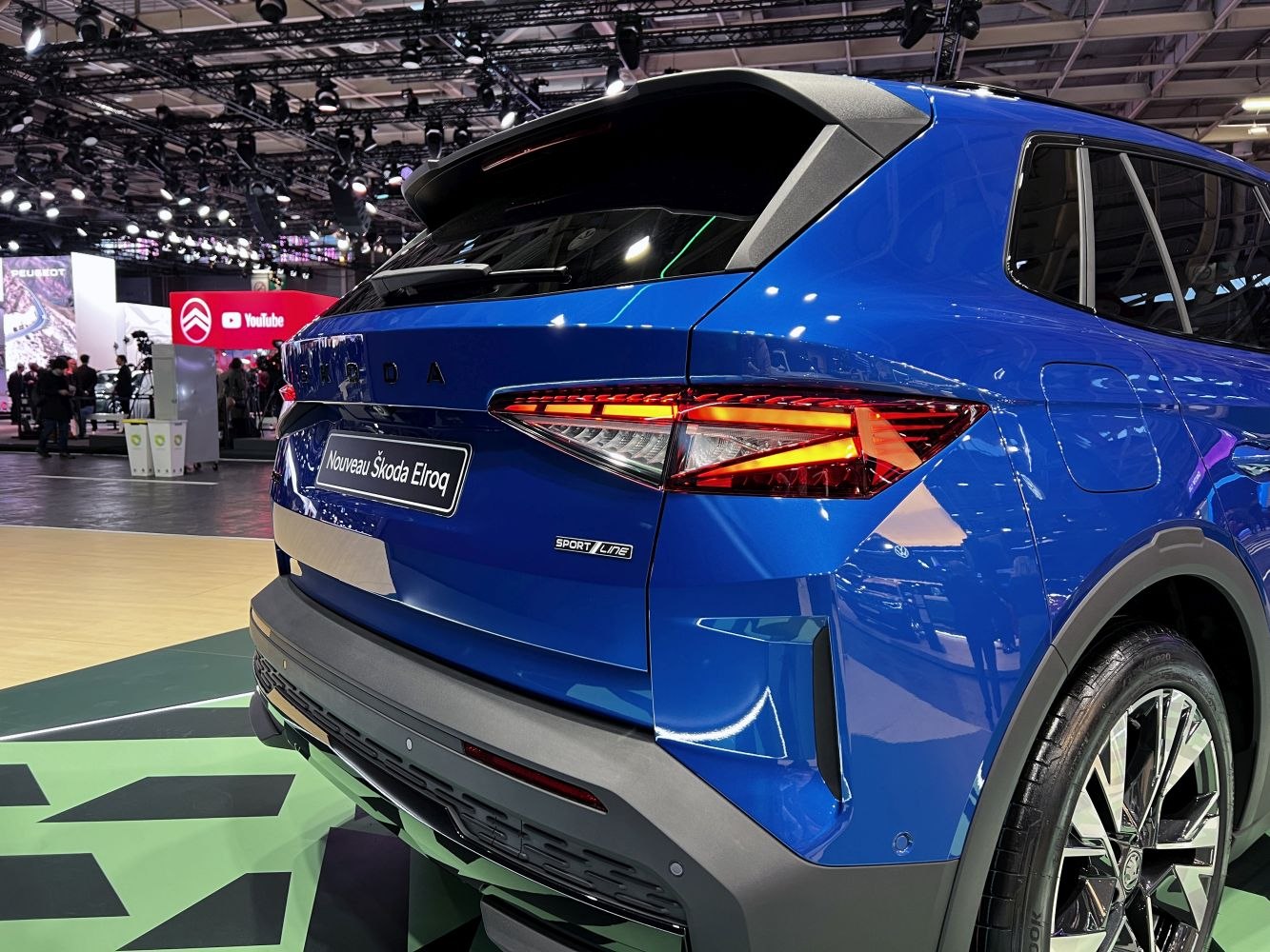 Sharp LED taillights with Sport Line badge on blue hatchback rear