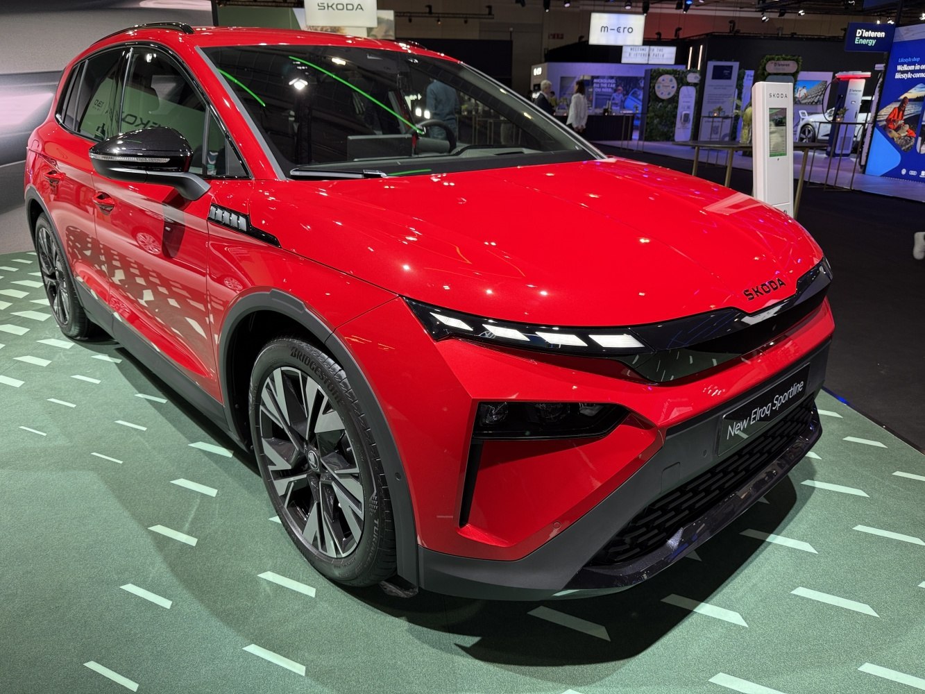 Red SUV's sleek front design with sharp LED headlights