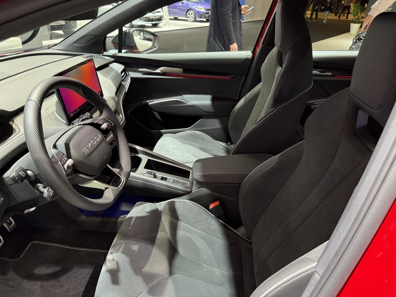 Digital dashboard and sporty front seats inside a modern car interior