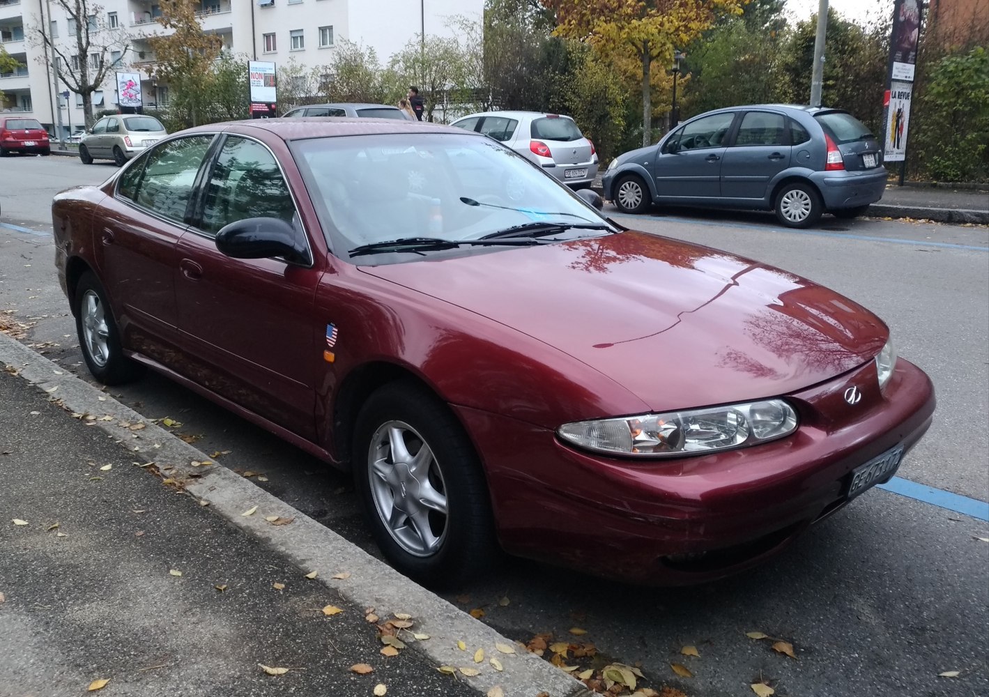Sedan with aerodynamic headlights and alloy wheels, streamlined body.