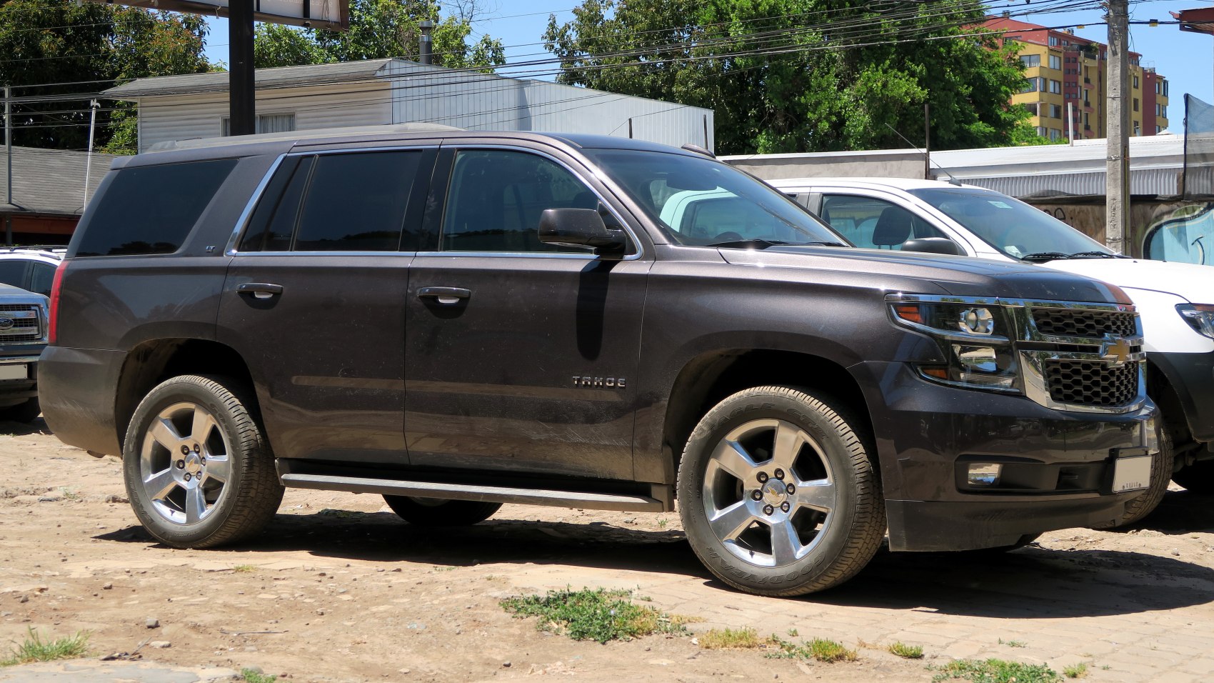 Side profile of large SUV with alloy wheels and tinted windows