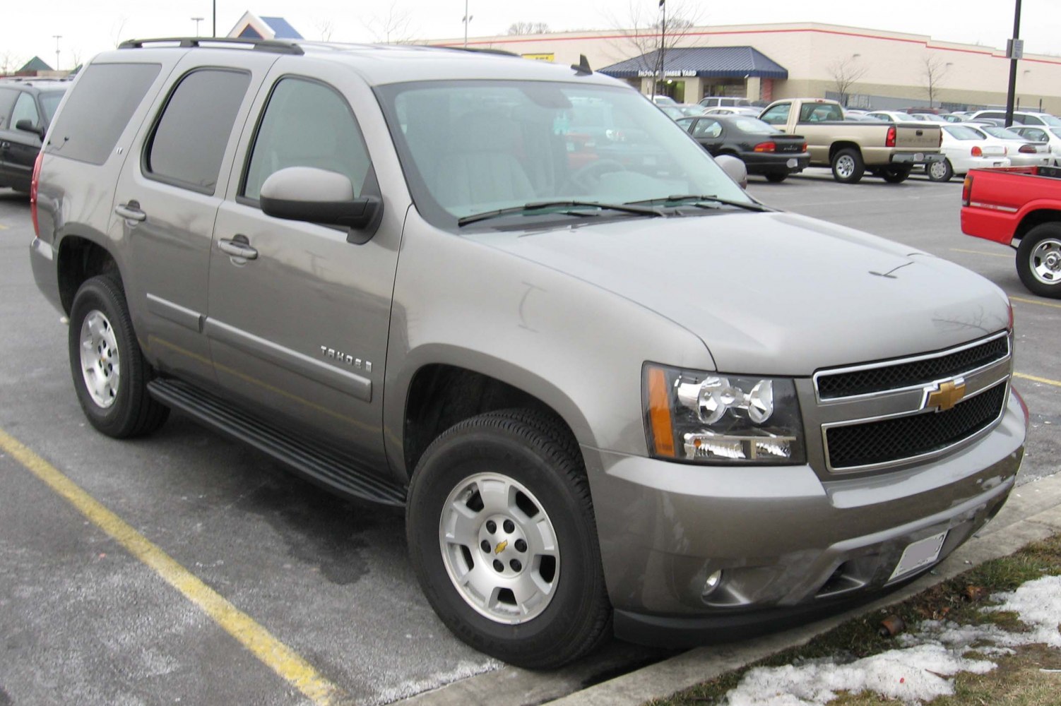 Front side view of a full-size SUV with robust design and tinted windows