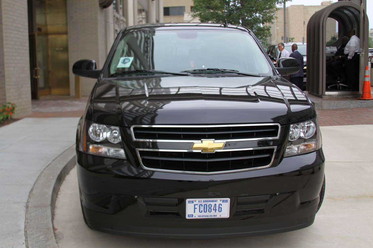 Front view of black SUV with Chevrolet grille and government license plate