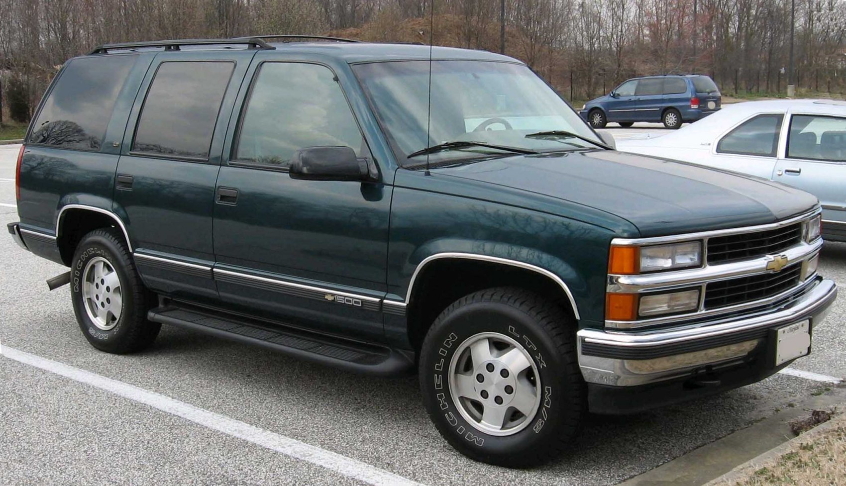 Side profile with running boards and off-road tires