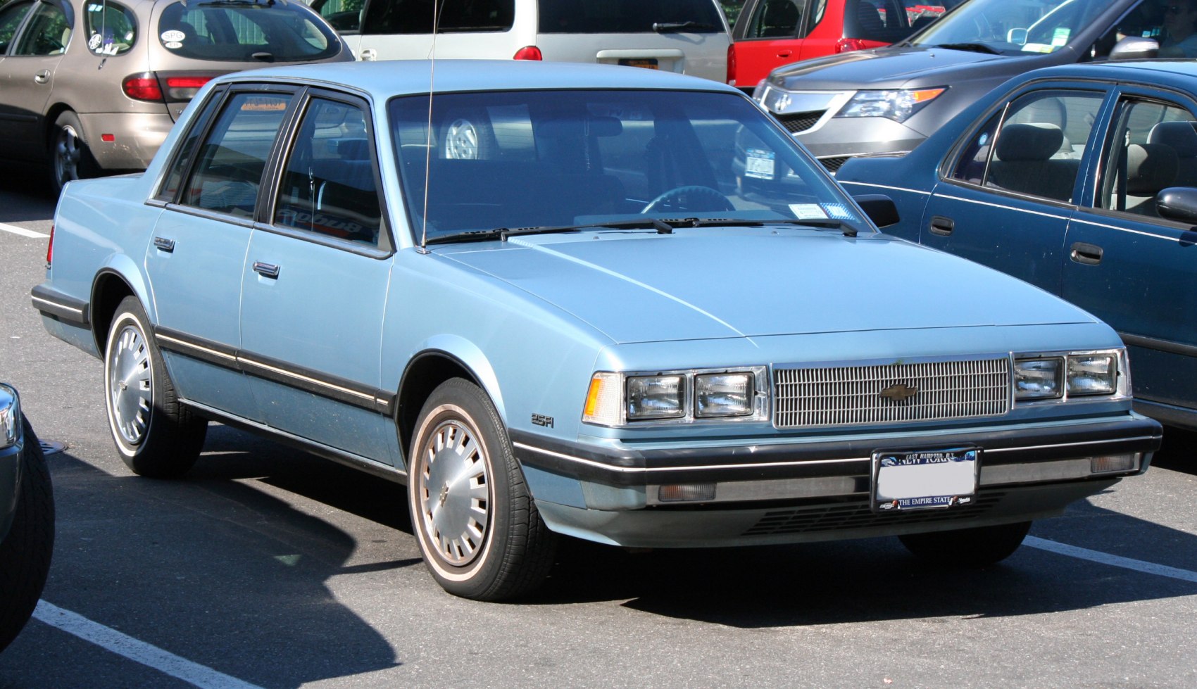 Classic sedan front side profile with square headlights and grille