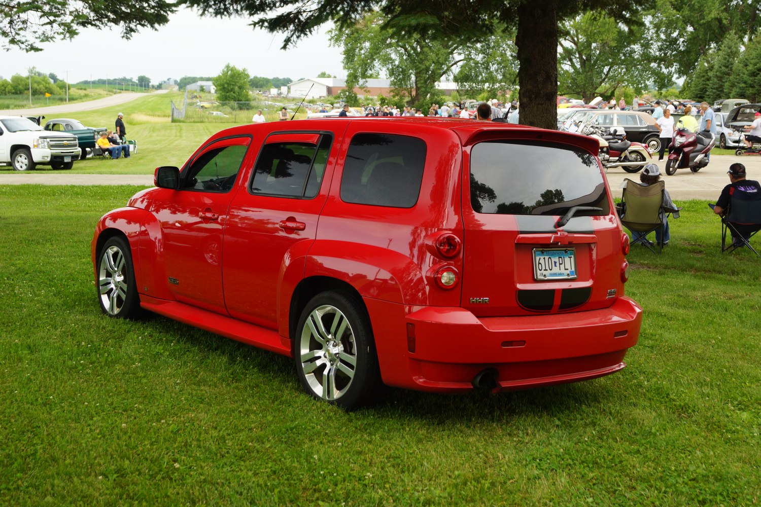 Red compact wagon with sporty rear side design and tinted windows