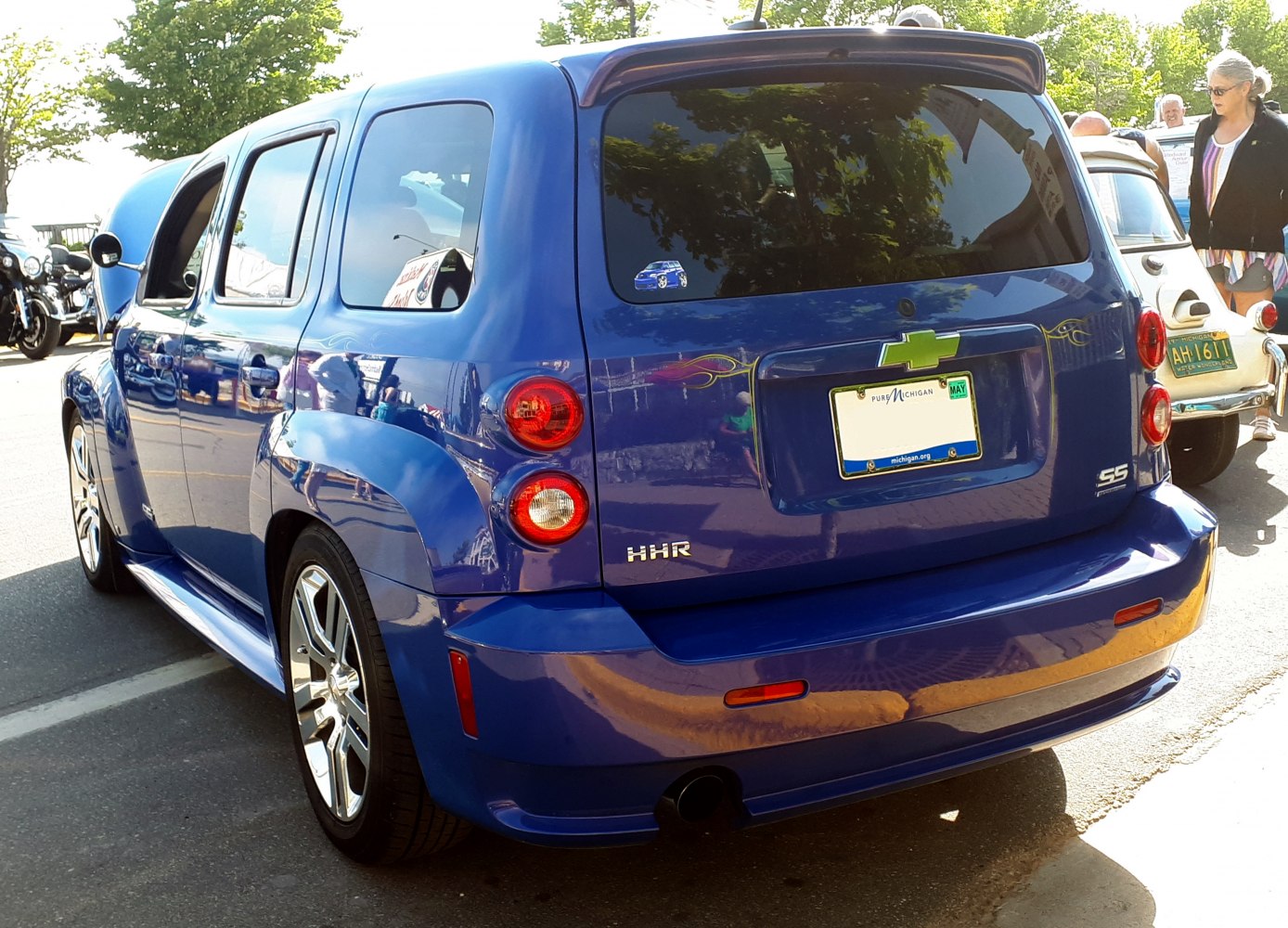 Blue compact SUV rear with round tail lights and wide rear window
