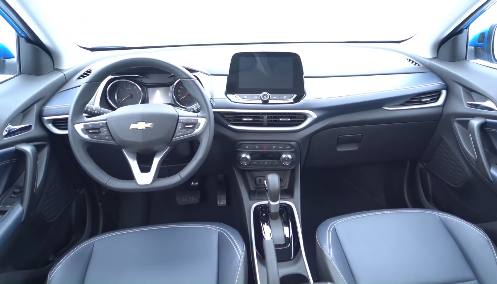 Steering wheel, dashboard, and central touchscreen display with climate controls