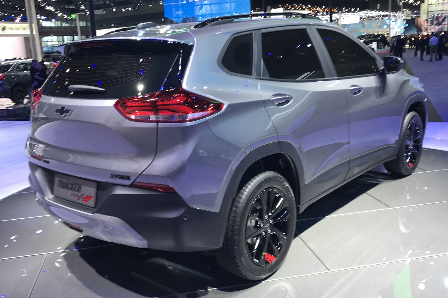 Rear side view with black alloy wheels and tinted windows