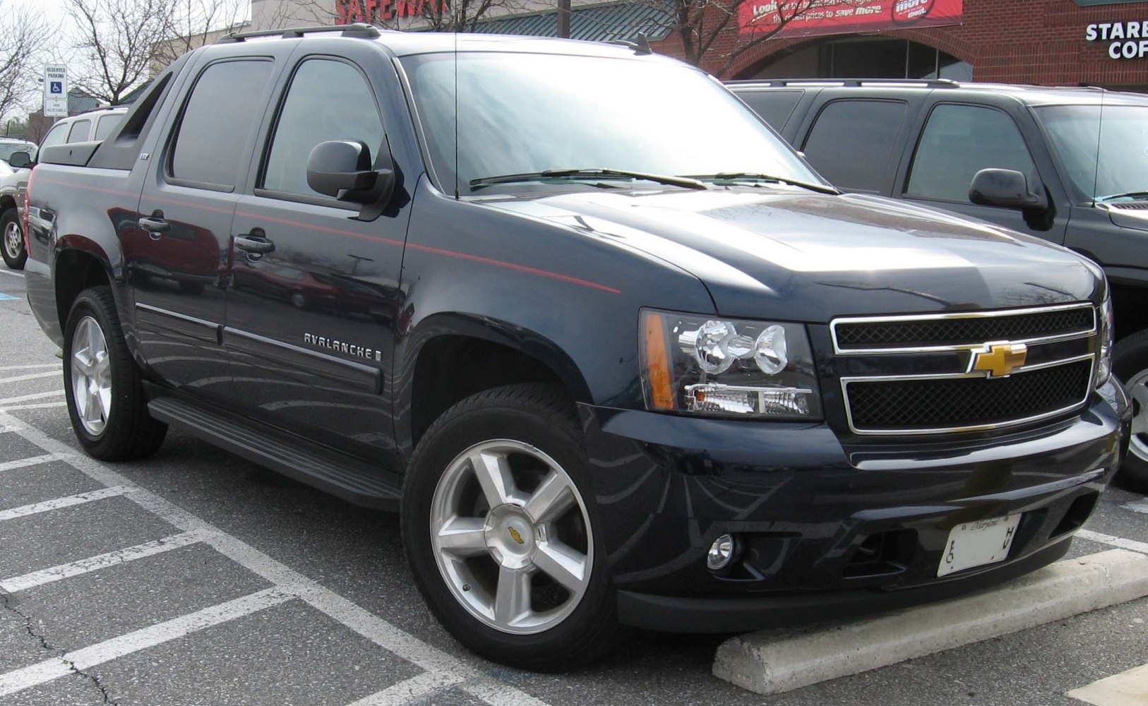 Pickup truck front side view with dual headlights and rugged design