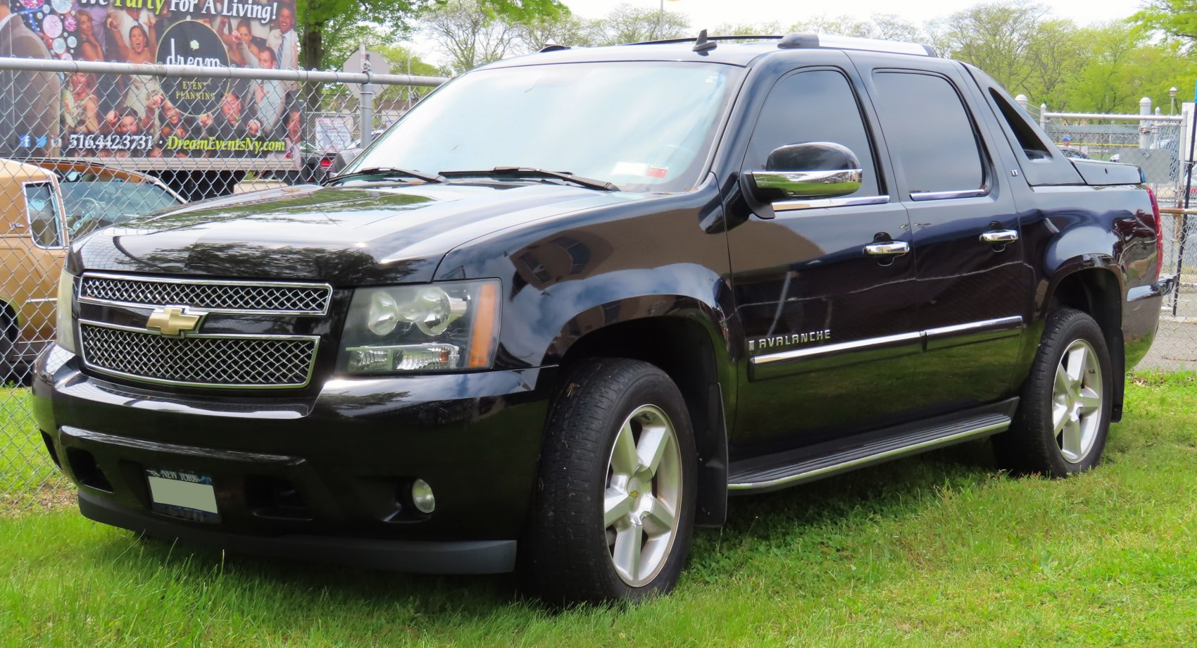 Crew cab pickup with bold grille and chrome side mirrors
