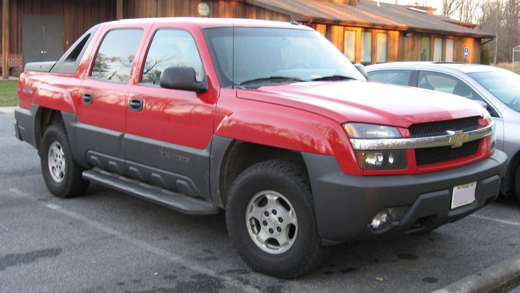 Front side view with black lower trim and step rails