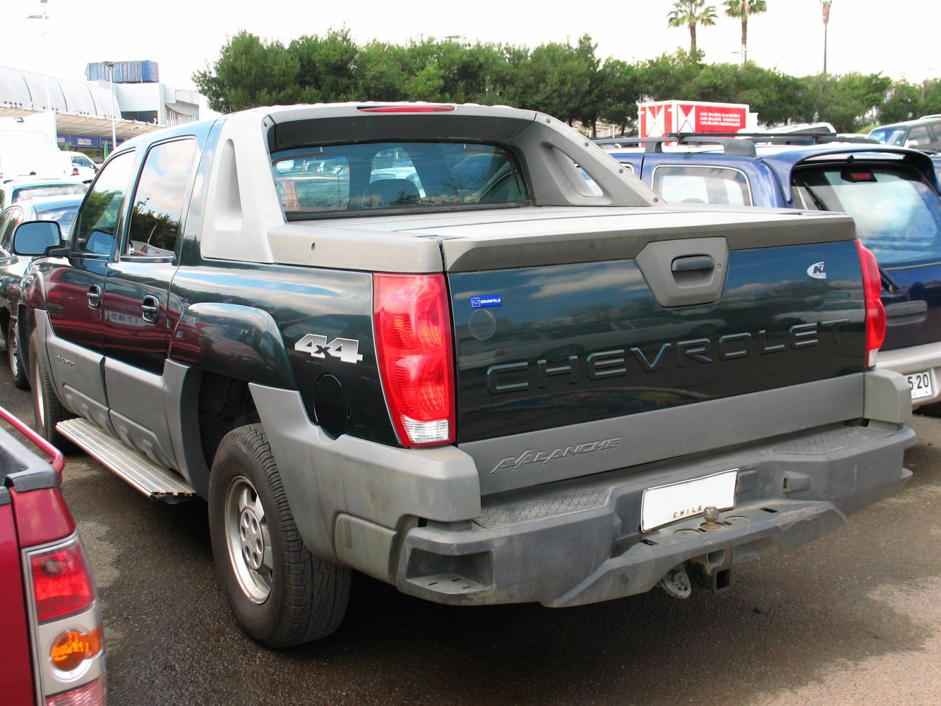Pickup truck rear with 4x4 badge and covered bed