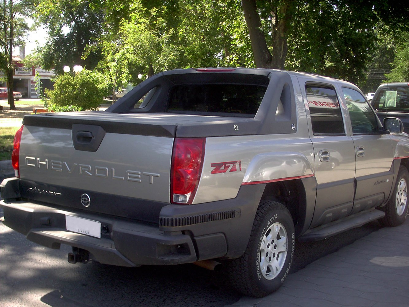 Rear and side view of pickup truck with Z71 badge and covered bed