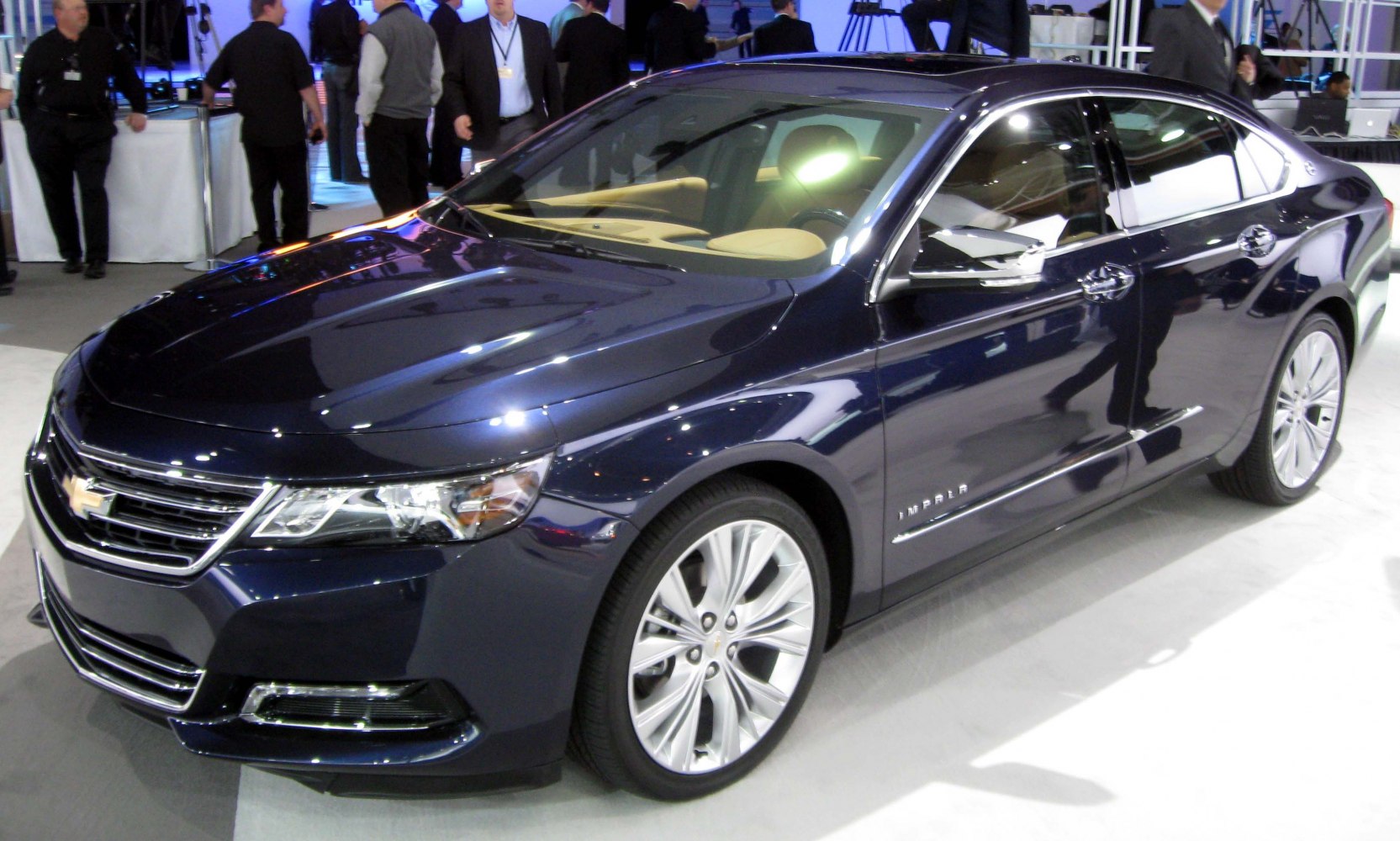 Front three-quarter view of modern sedan with LED headlights and alloy wheels