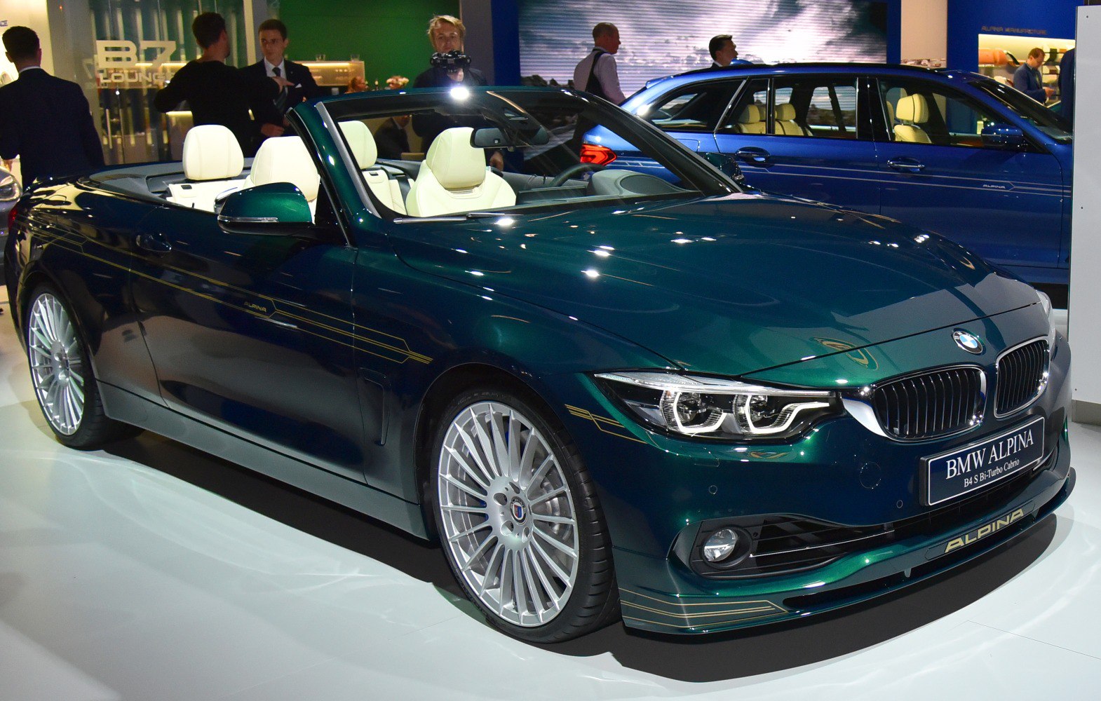 Dark green facelift convertible with white leather seats and multi-spoke alloy wheels