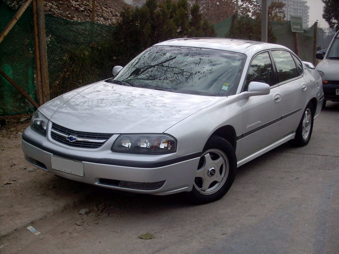 Front-side view of a silver four-door sedan with alloy wheels