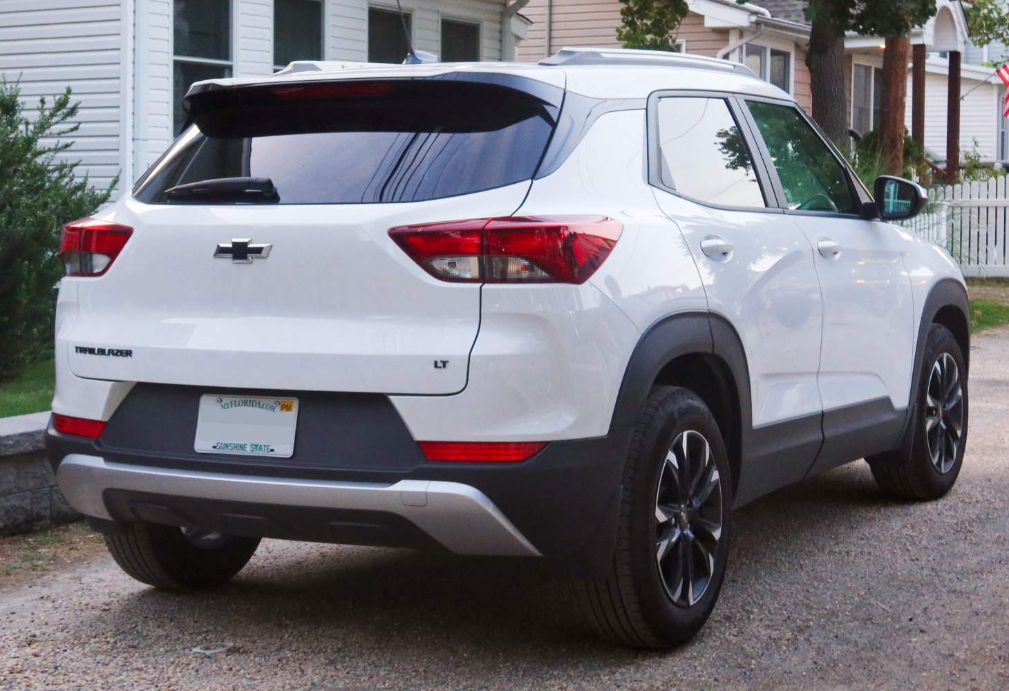 Rear view of modern SUV with taillights, rear bumper, and alloy wheels.