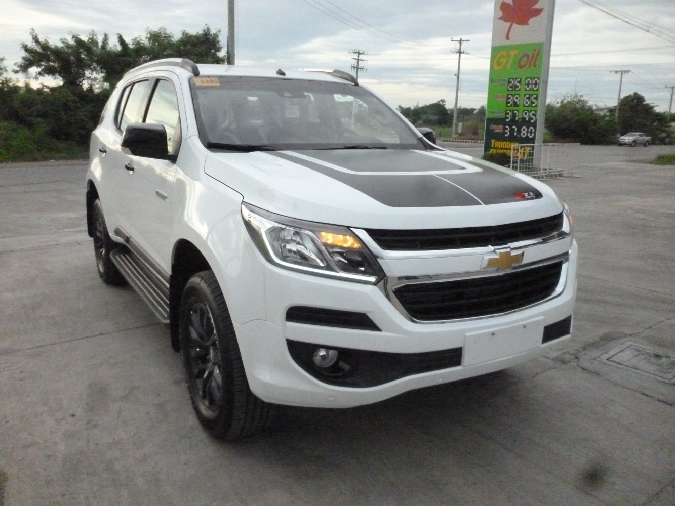 Front view of SUV with black hood decal and bold headlights