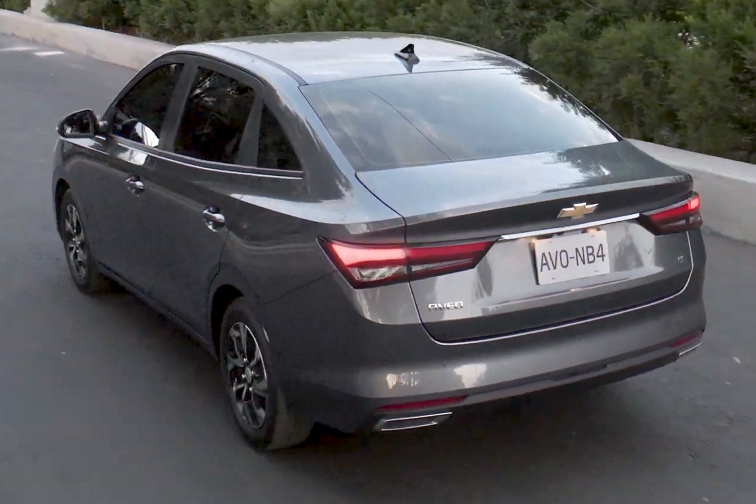 Sleek rear tail lights and aerodynamic trunk design on a modern sedan.