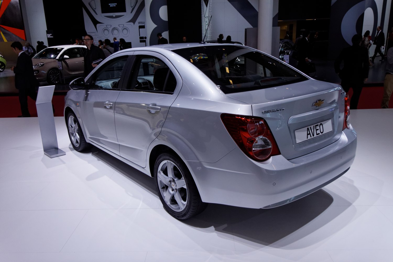 Rear and side view of a compact sedan with distinctive round taillights.