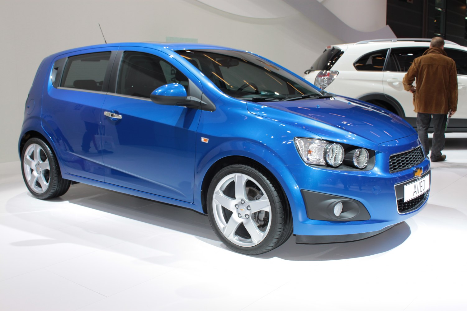 Blue hatchback with twin headlamps and sporty alloy wheels