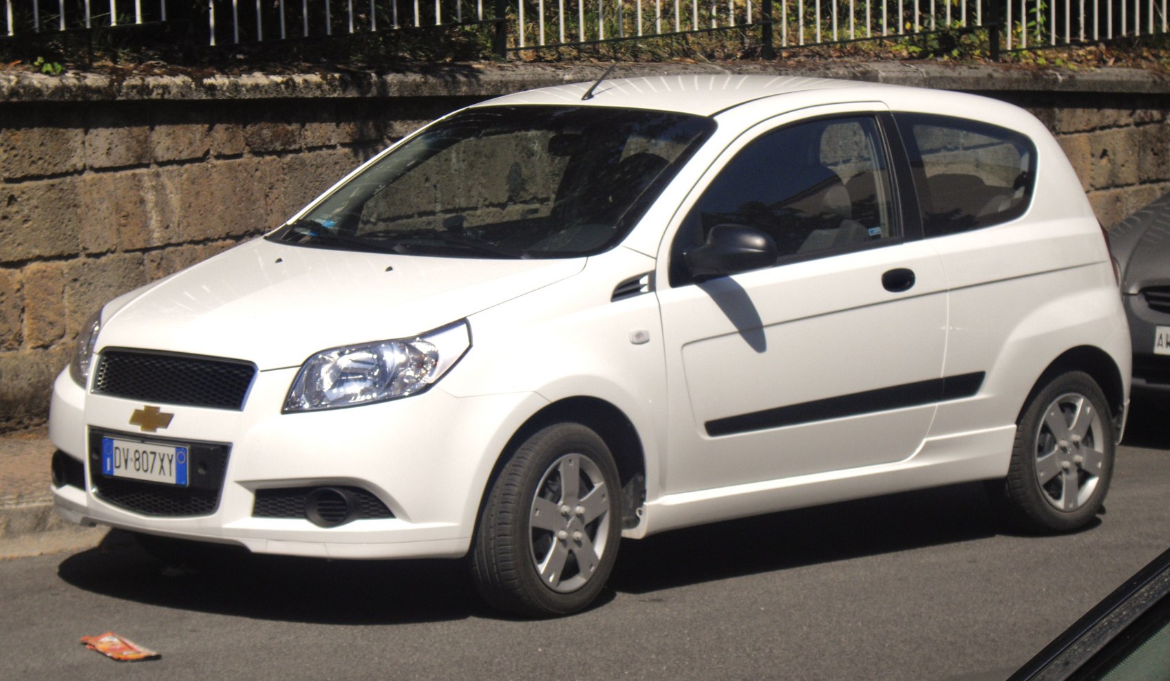 White 3-door hatchback with facelift front grille and headlamps