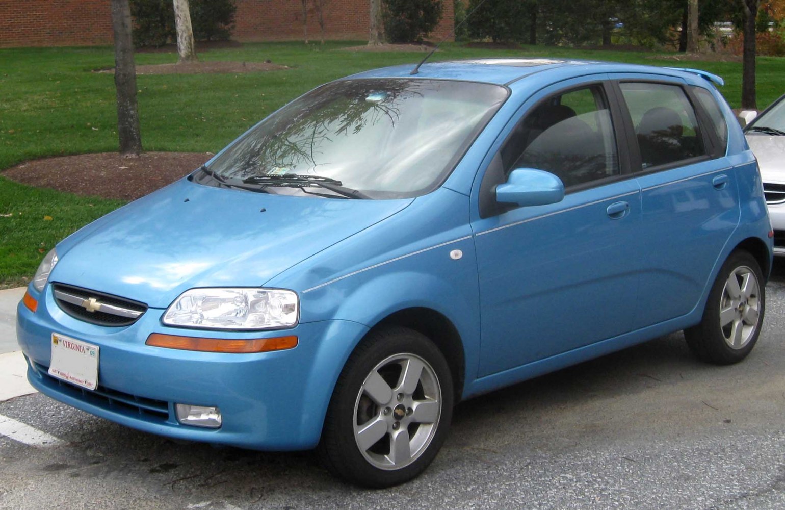 Compact blue 5-door hatchback with alloy wheels and distinctive front grille