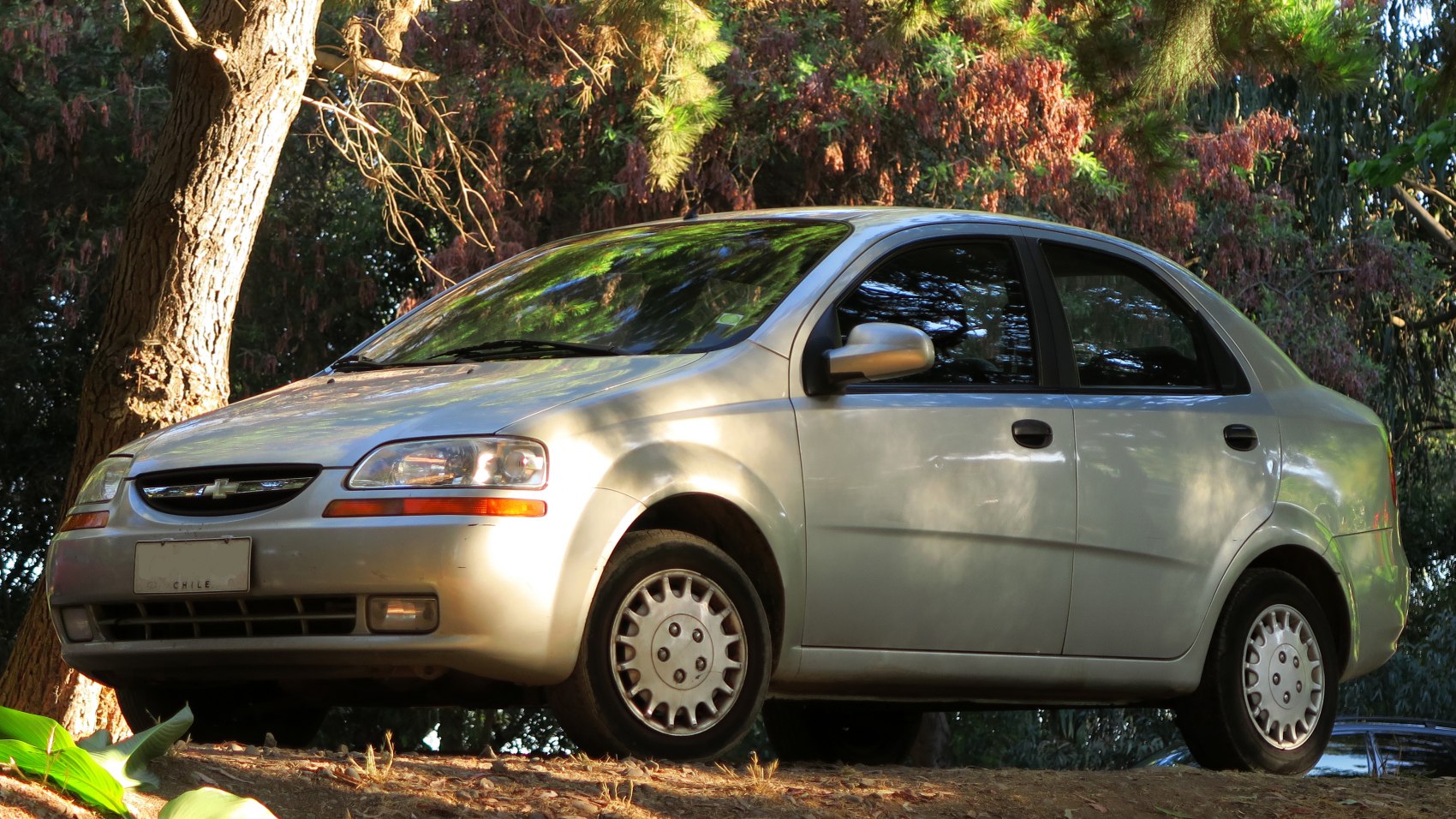 Front side view of a compact sedan with classic design elements.