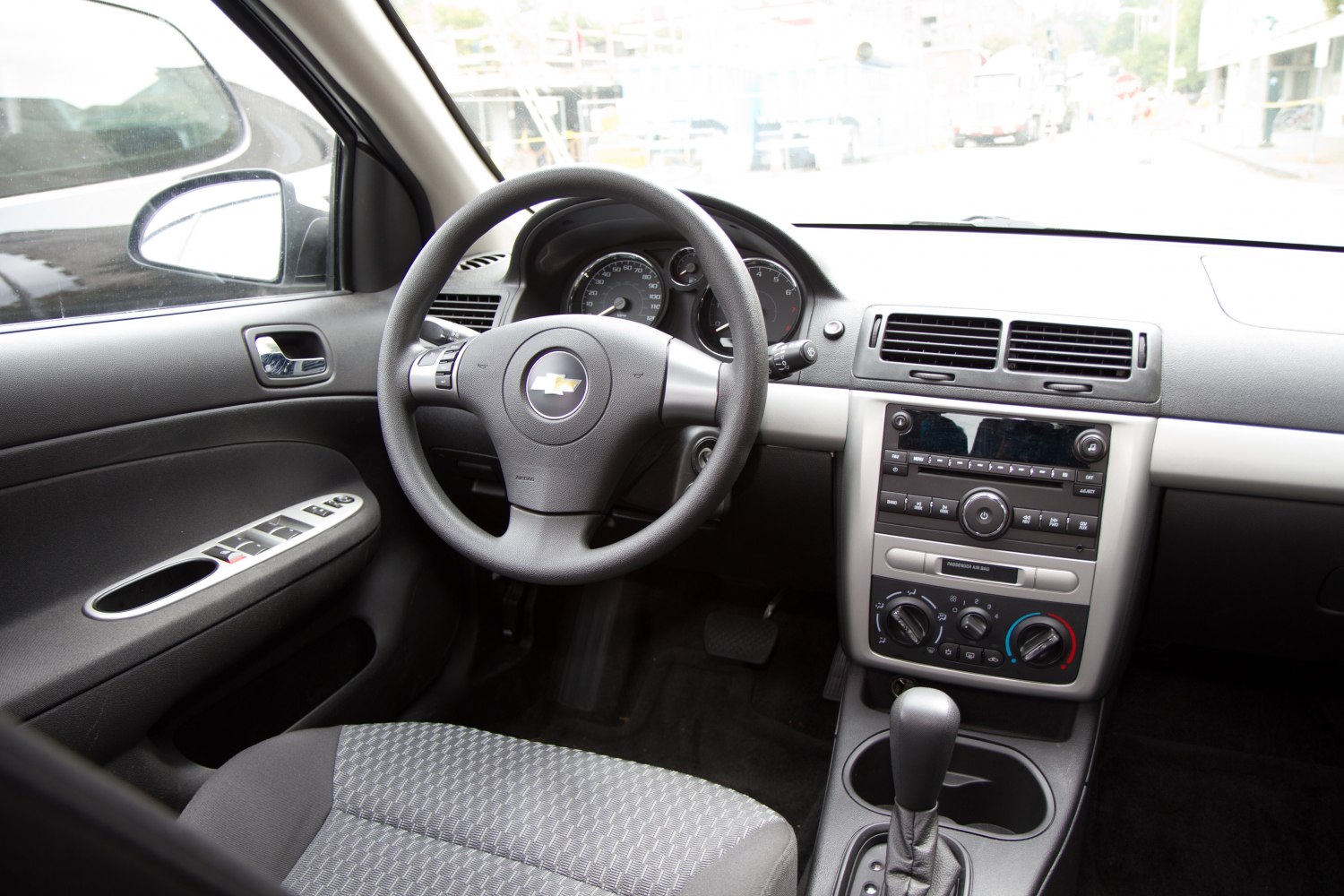 Steering wheel, dashboard, radio, climate control knobs, gear shifter