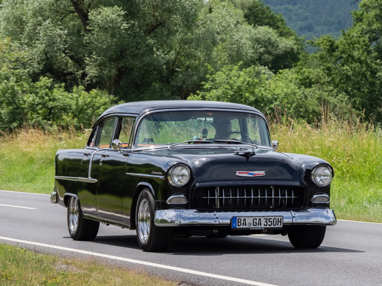 Vintage sedan front with chrome grille and bumper