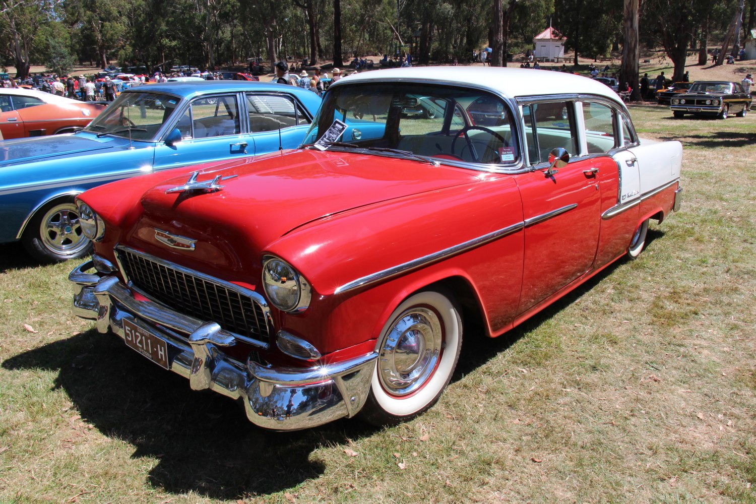 Classic vintage two-tone sedan with chrome bumpers and hood ornament