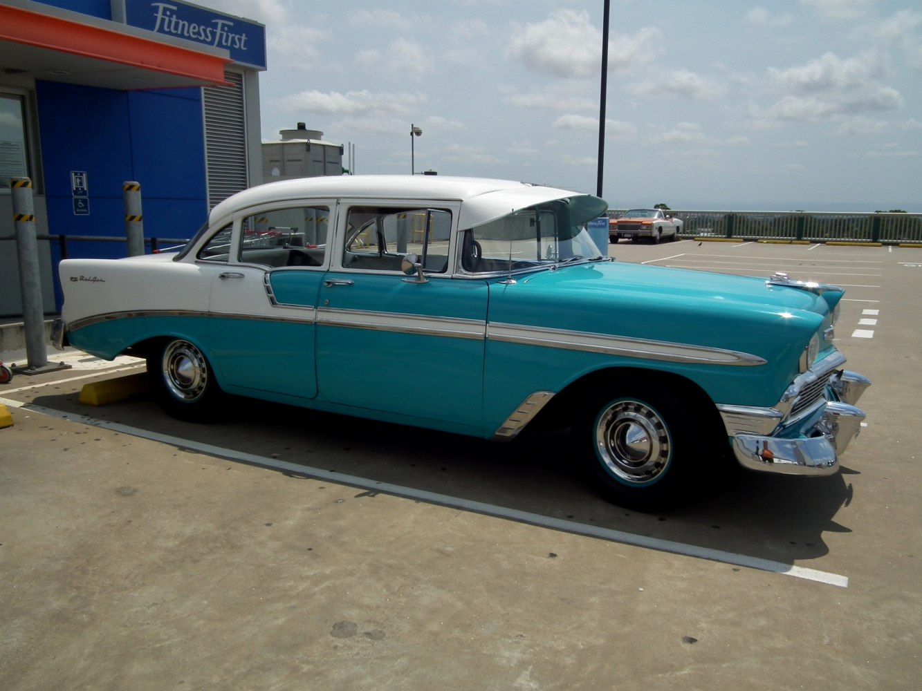 Classic vintage two-tone car with chrome trim and bumpers