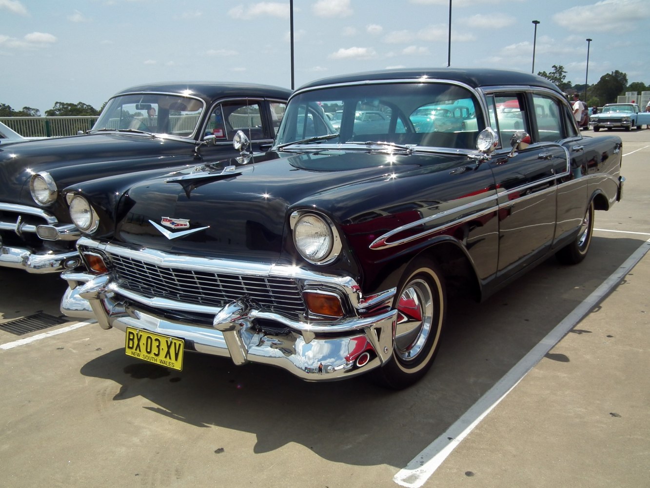 Classic car front grille with chrome details and headlights