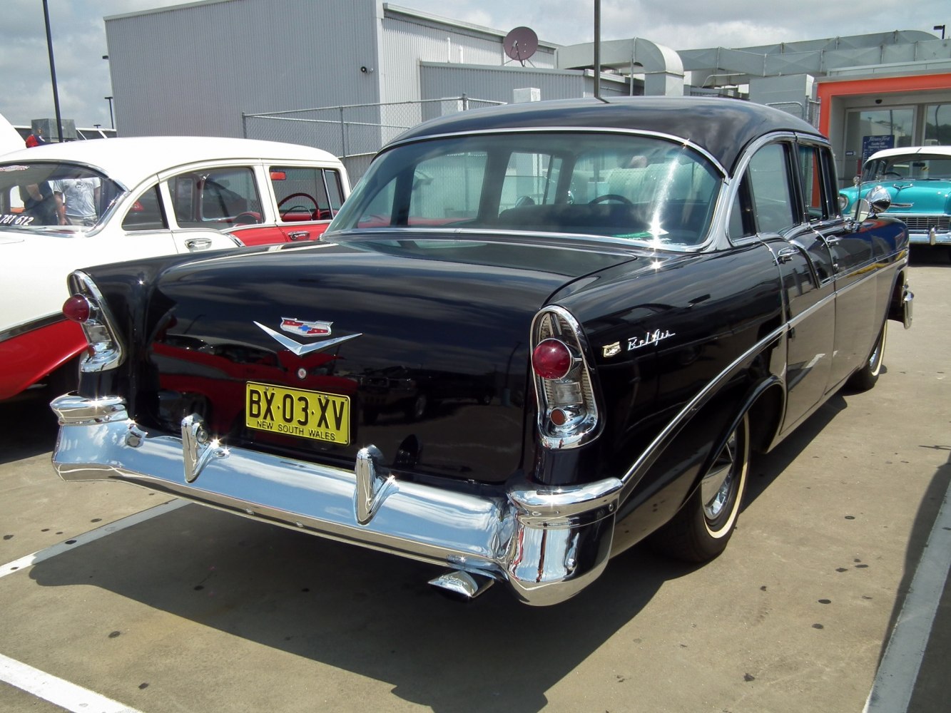 Rear of classic car with distinctive tailfins and chrome bumper