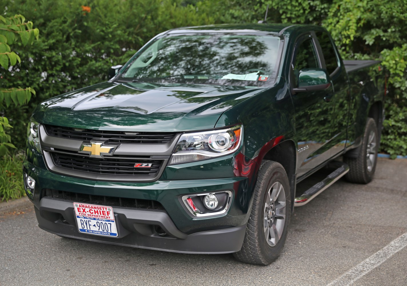 Front view of a pickup truck with headlights and grille