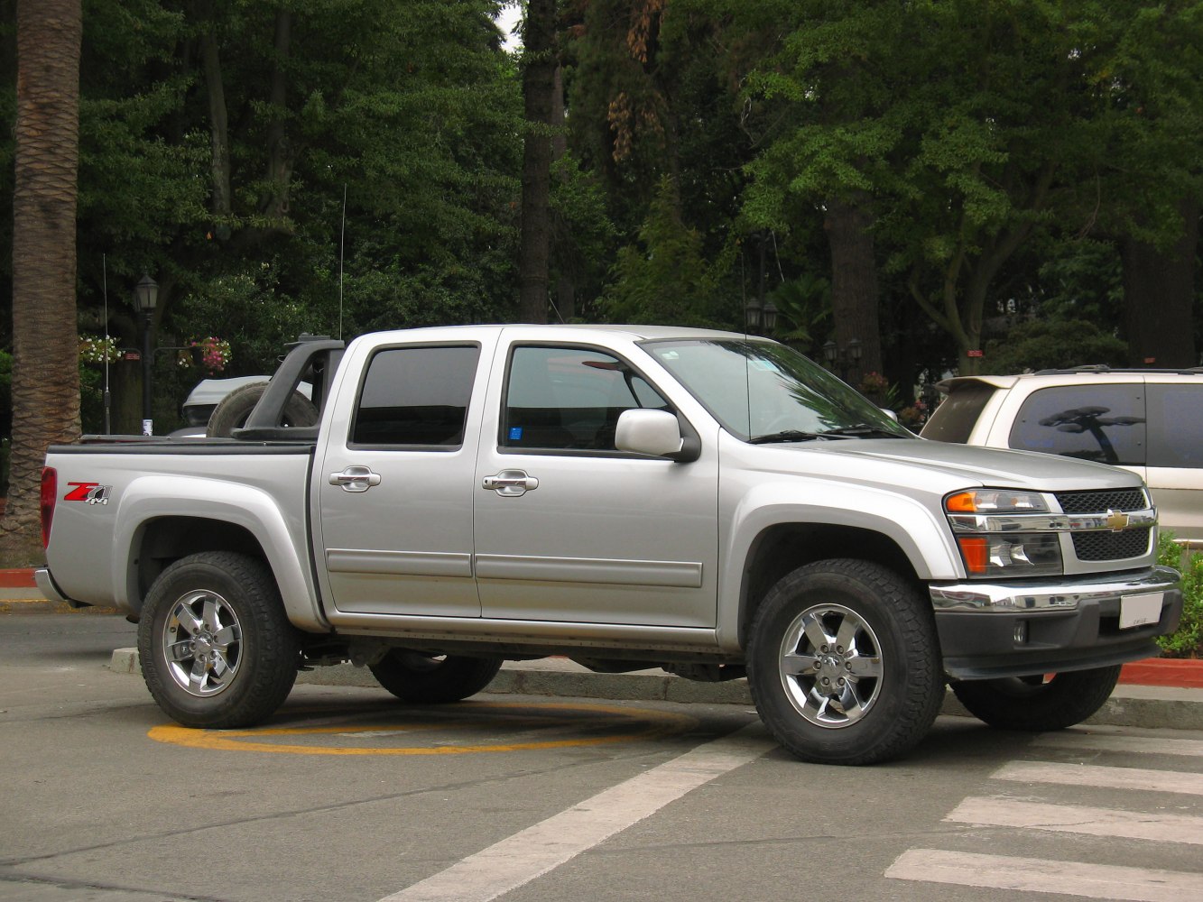 Silver double cab pickup truck with alloy wheels and Z71 badge.