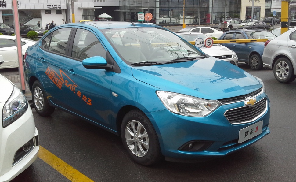 Blue compact sedan front and side profile with alloy wheels