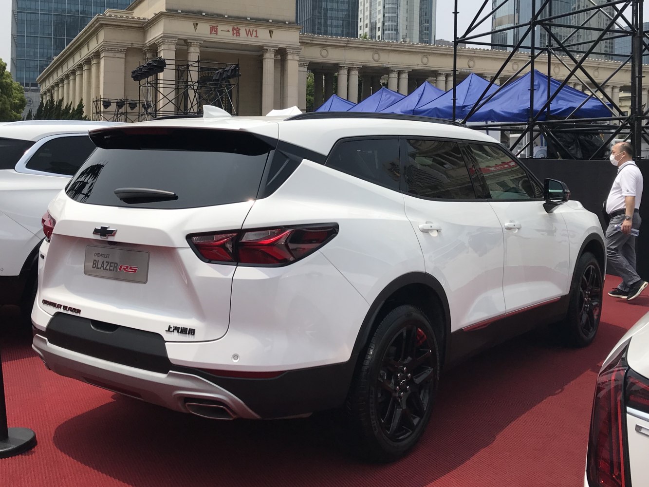 Rear and side view of a modern SUV with sharp tail lights and black alloy wheels