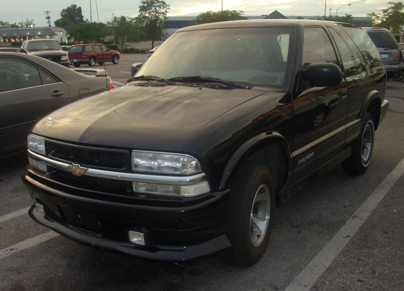 Black 2-door SUV with unique front grille and dual rectangular headlights.